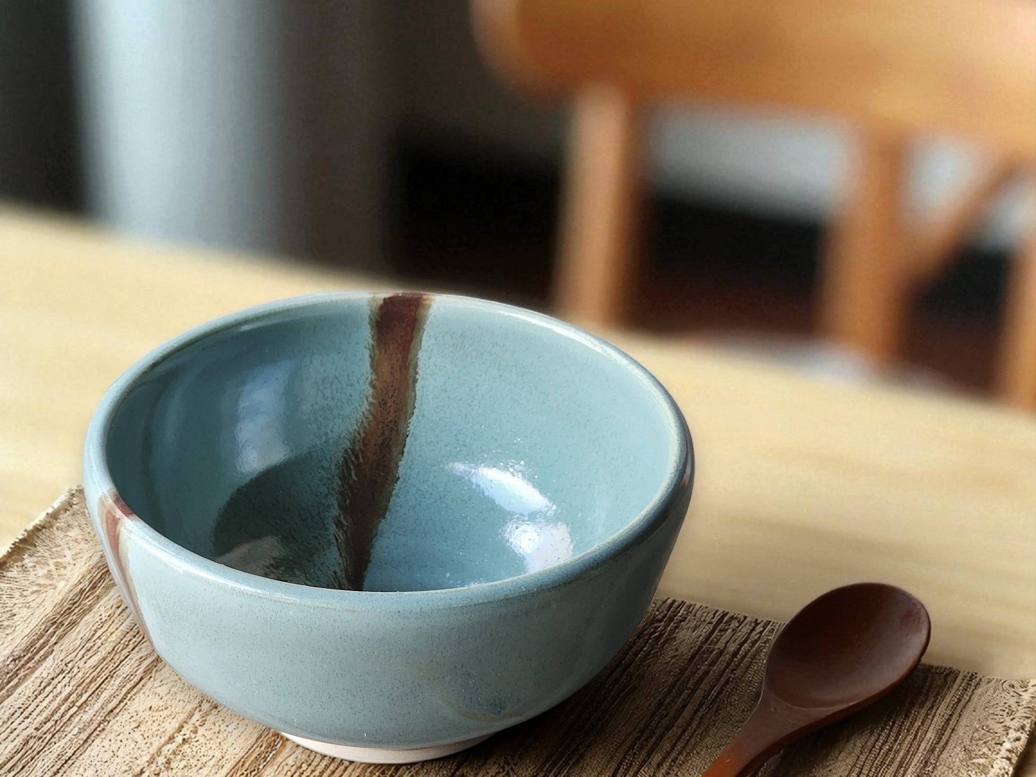 Handmade pottery cereal bowl spearmint green with brown slash