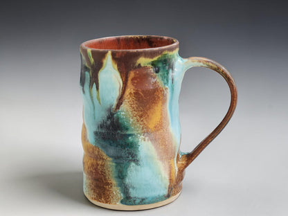 Handmade stoneware mug with flowing turquoise, rust and green glaze, crafted by Buxton Pottery in Melbourne Australia