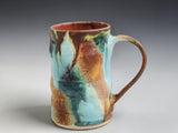 Handmade stoneware mug with flowing turquoise, rust and green glaze, crafted by Buxton Pottery in Melbourne Australia