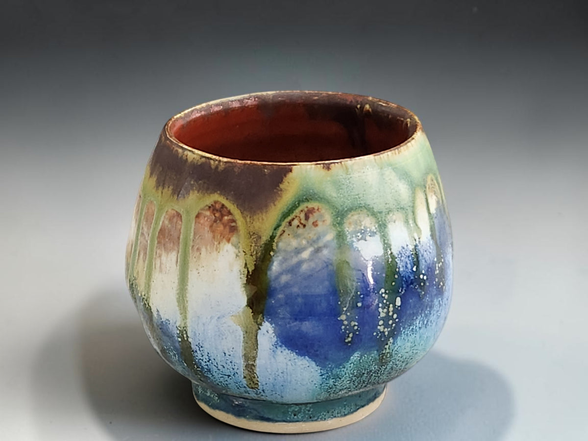 Bush Creek yunomi cup with chocolate brown rim and deep blue glaze