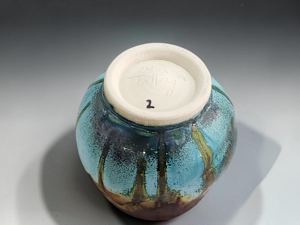 Teal ceramic whisky cup with unglazed clay foot ring