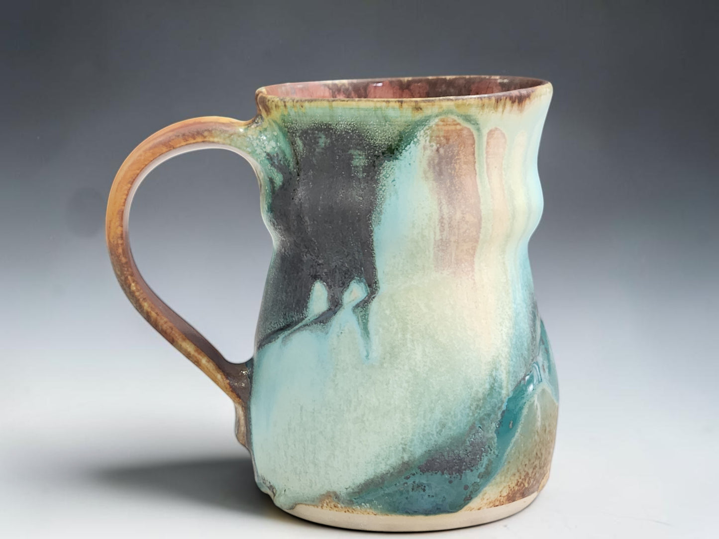 One of a kind ceramic mug with ash glaze drips and earthy Australian landscape tones