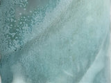 Close-up of flowing Bush Creek Mist glaze on handmade pottery mug