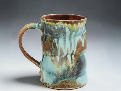 Handmade pottery mug with red brown interior glaze, crafted by Buxton Pottery in Melbourne Australia