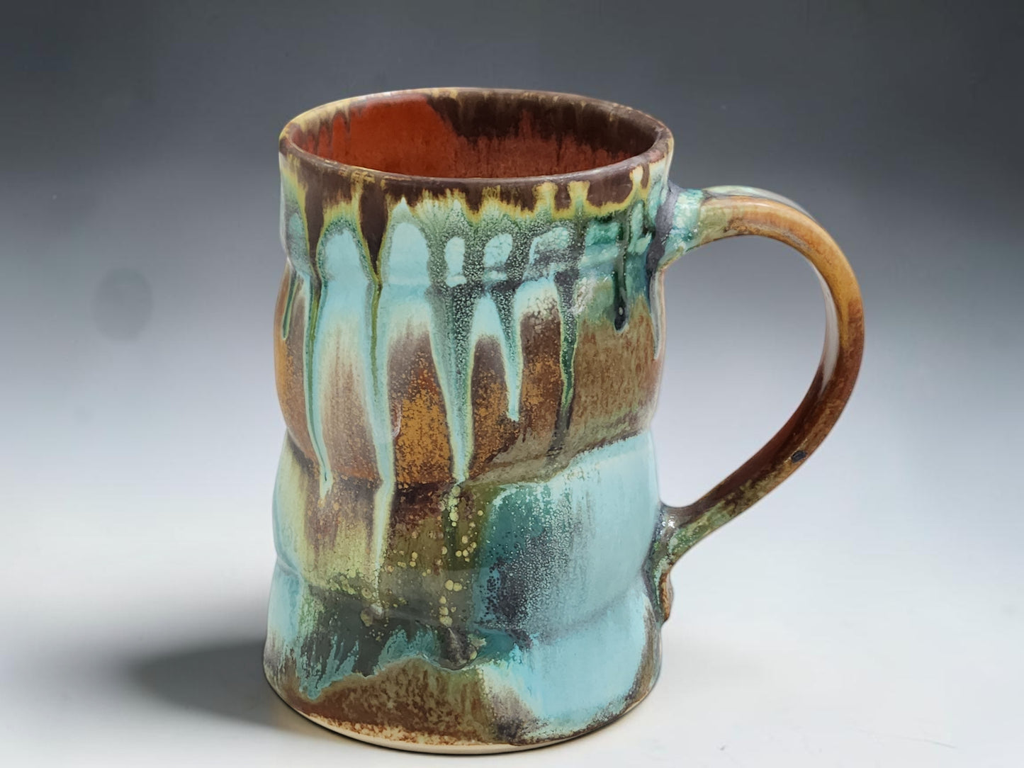 Wheel-thrown ceramic coffee mug with comfortable handle and one-of-a-kind handmade glaze