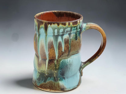 Wheel-thrown ceramic coffee mug with comfortable handle and one-of-a-kind handmade glaze