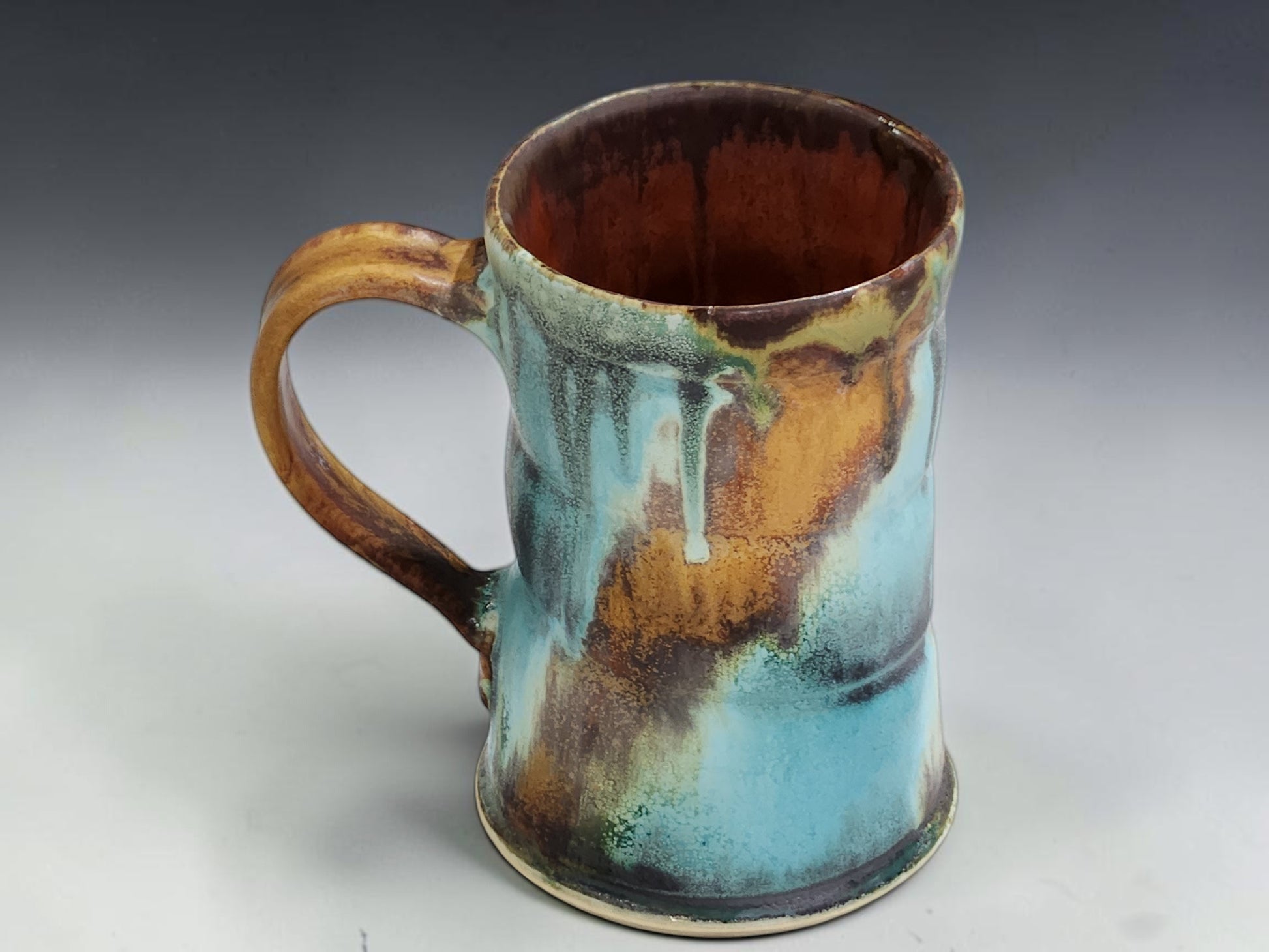 Wheel-thrown ceramic coffee mug with comfortable handle and one-of-a-kind handmade glaze