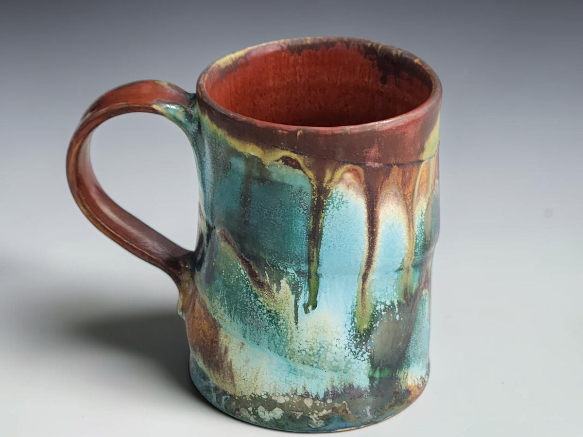 Buxton Pottery 400ml mug with dark green bands and pale yellow glaze drips.