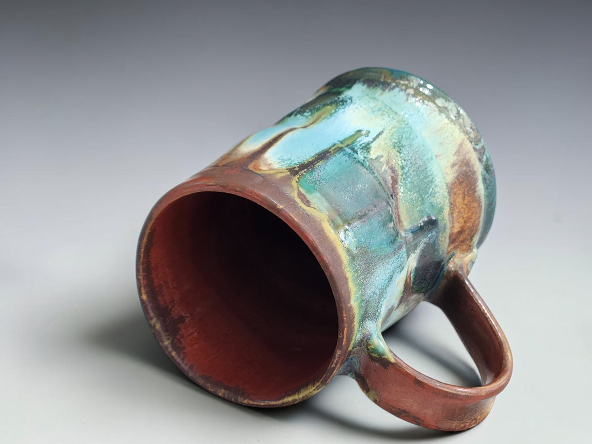 Handmade coffee mug measuring 11cm tall with an 8.5cm base.