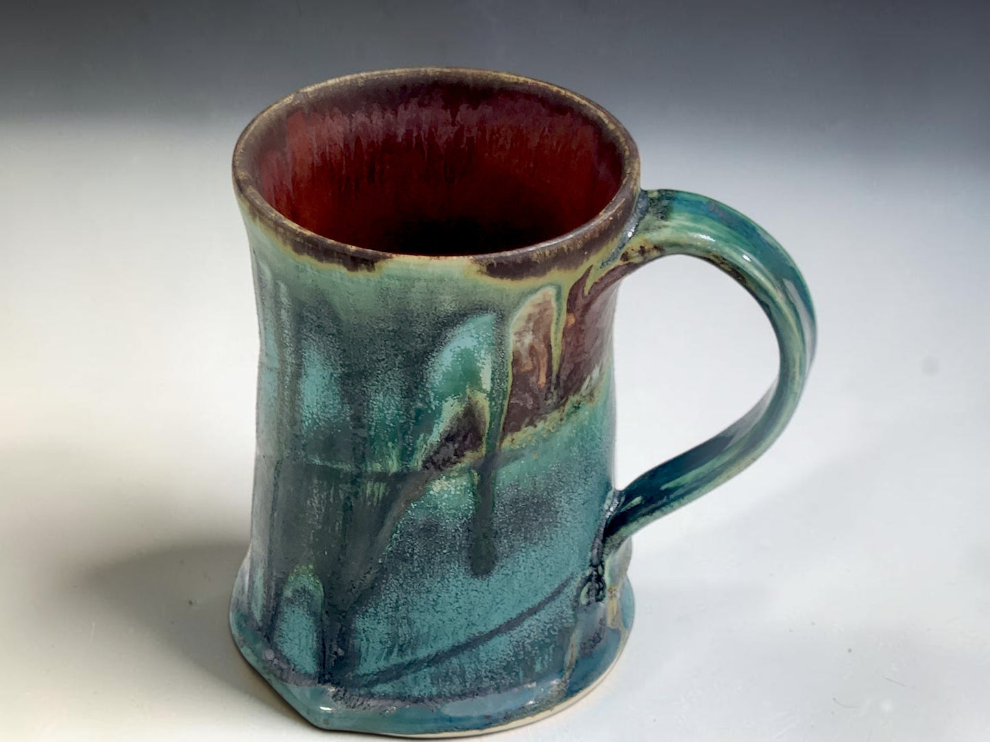 Wheel-thrown stoneware mug featuring reactive Bush Creek Earth glaze inspired by Australian bush landscapes.