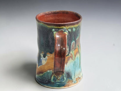 Buxton Pottery 300ml mug with a dark brown rim and gently flared base.