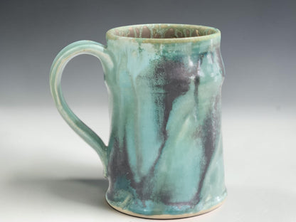 Handmade stoneware mug with flowing turquoise green glaze, crafted by Buxton Pottery in Melbourne Australia