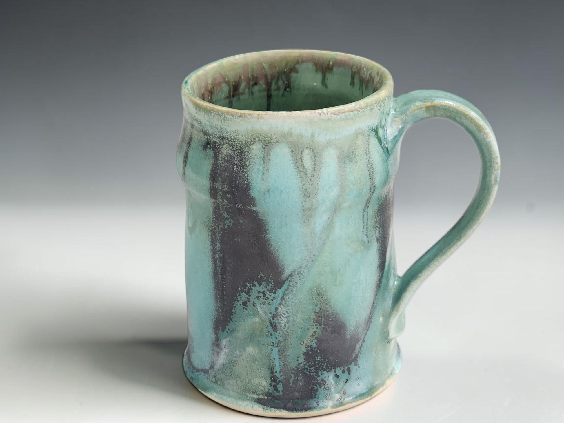 Australian handmade pottery mug with unique glaze variation and comfortable hand-pulled handle