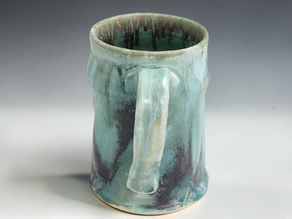 Handmade 350ml stoneware mug with soft turquoise green glaze, ideal for coffee, tea or hot chocolate