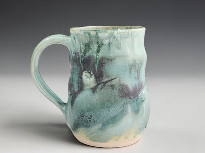 Handmade stoneware mug with flowing seafoam green glaze, crafted by Buxton Pottery in Melbourne Australia