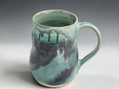 Australian handmade pottery mug with unique glaze variation and comfortable hand-pulled handle