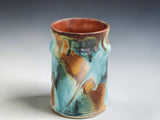 Australian handmade pottery mug with unique Bush Creek glaze variation and hand-pulled handle
