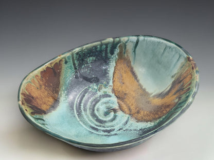 Buxton Pottery handmade altered bowl with turquoise, green, rust and ochre glaze movement