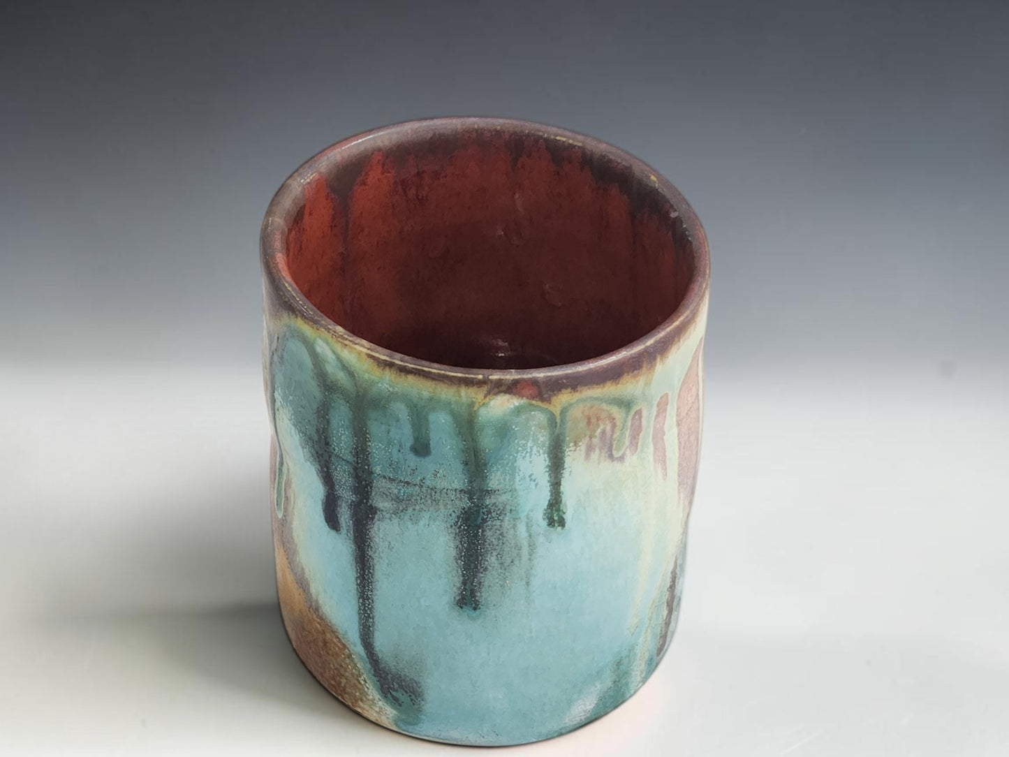 Handmade ceramic tumbler in Bush Creek glaze, crafted by Buxton Pottery in Melbourne Australia