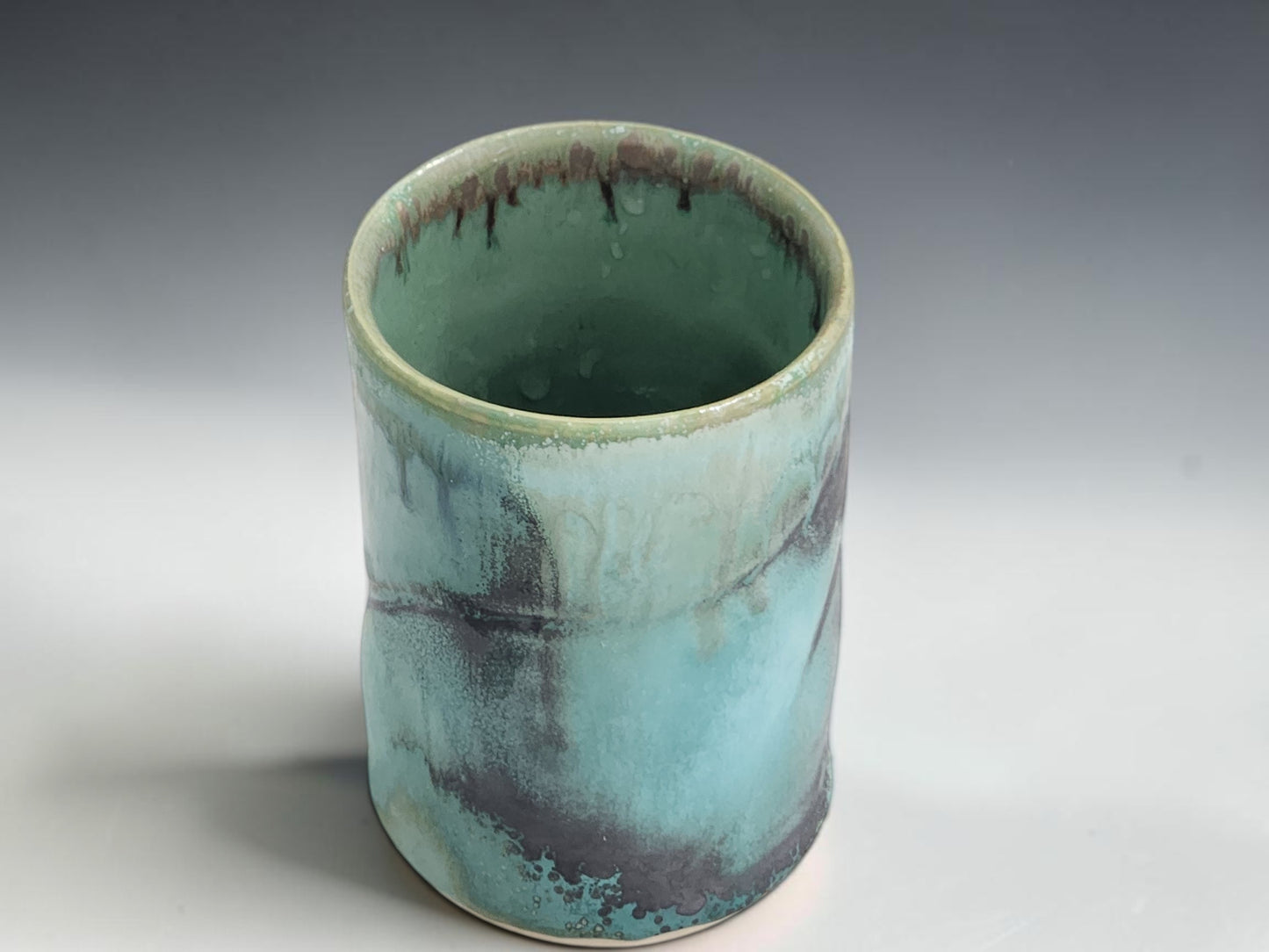 Australian handmade ceramic tumbler with glossy turquoise glaze and natural handmade variation