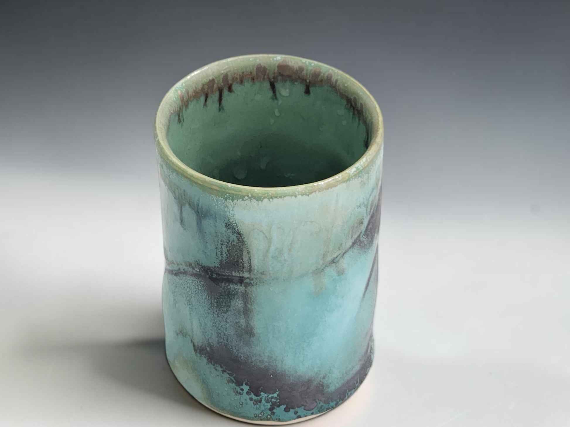 Australian handmade ceramic tumbler with glossy turquoise glaze and natural handmade variation