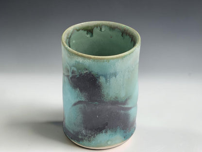 Wheel-thrown pottery cup in green blue glaze, handmade in Melbourne studio