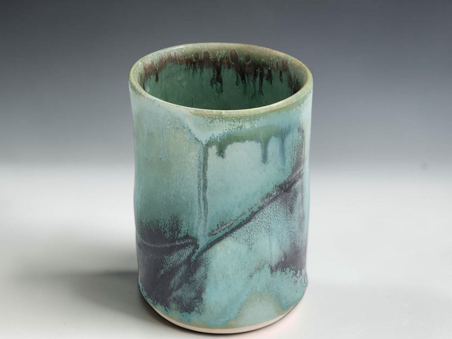 Handmade ceramic tumbler in soft turquoise green glaze, crafted by Buxton Pottery in Melbourne Australia