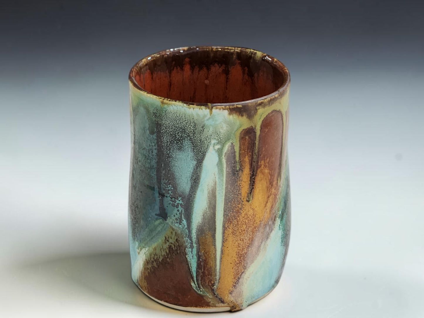 Handmade ceramic tumbler in Bush Creek glaze, crafted by Buxton Pottery in Melbourne Australia