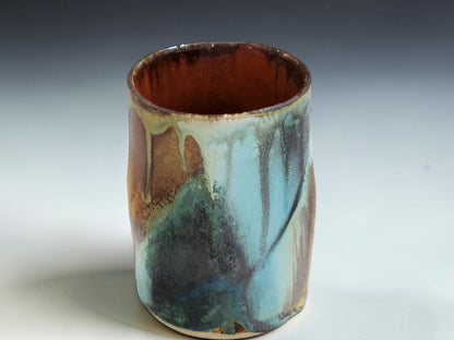 Australian handmade ceramic tumbler with tall shape and one-of-a-kind glaze variation
