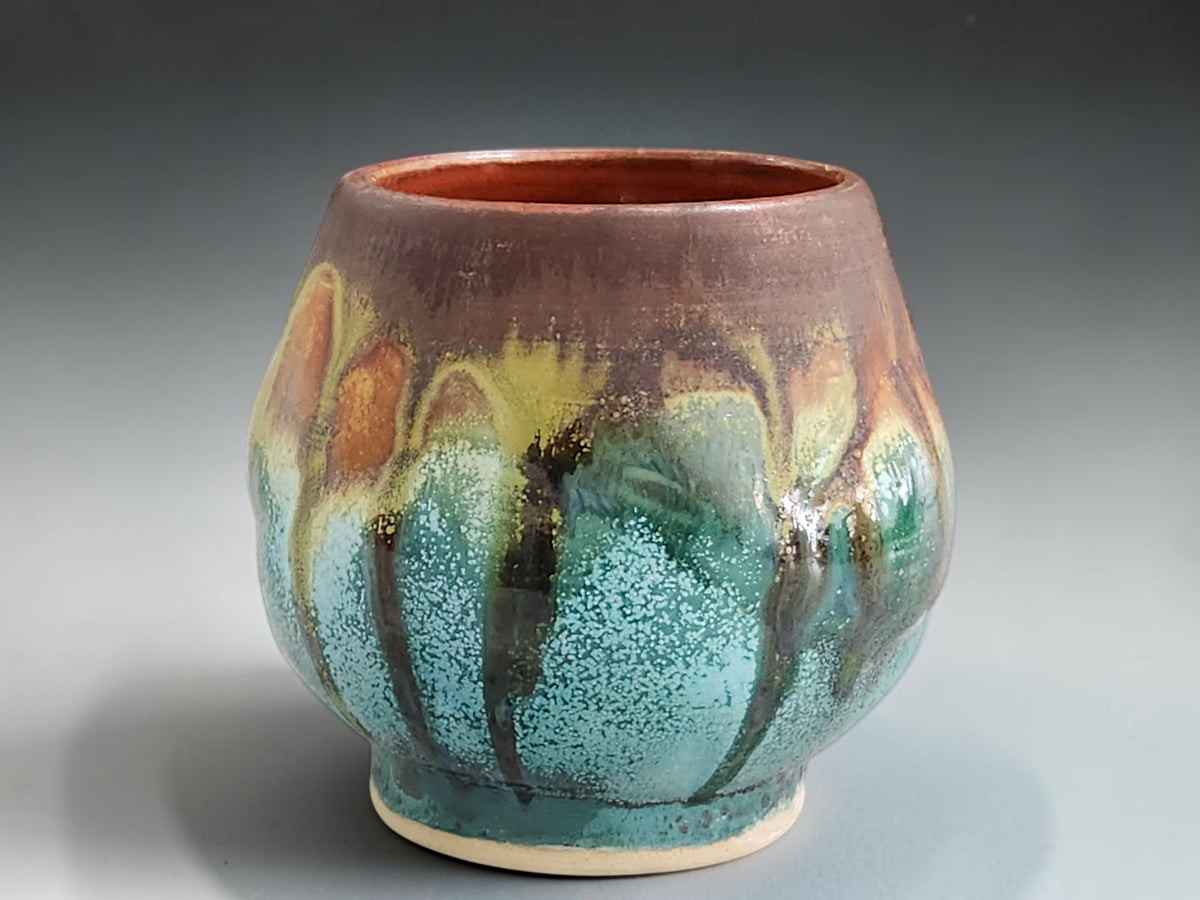 Handmade Melbourne pottery yunomi with organic multicoloured drips