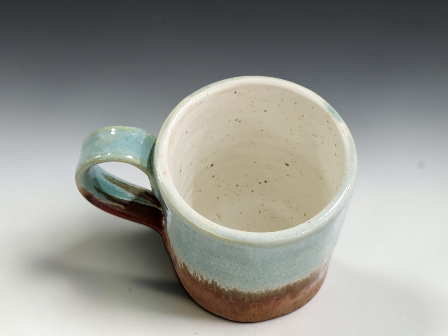 Small ceramic coffee cup measuring 6.5cm tall and 6.5cm wide