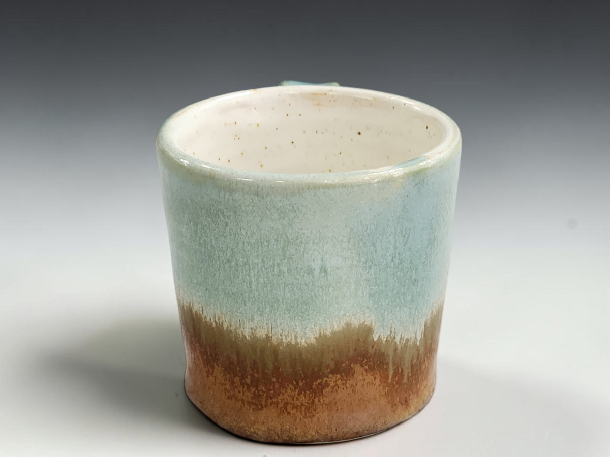 Speckled cream interior of handmade pottery espresso cup