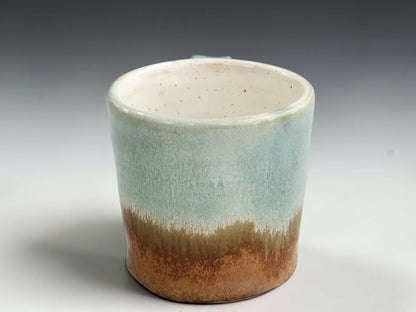 Speckled cream interior of handmade pottery espresso cup