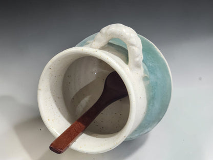 Speckled cream and soft green ceramic salt pig with wooden spoon