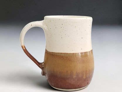 Speckled cream glazed interior of handmade Australian coffee mug