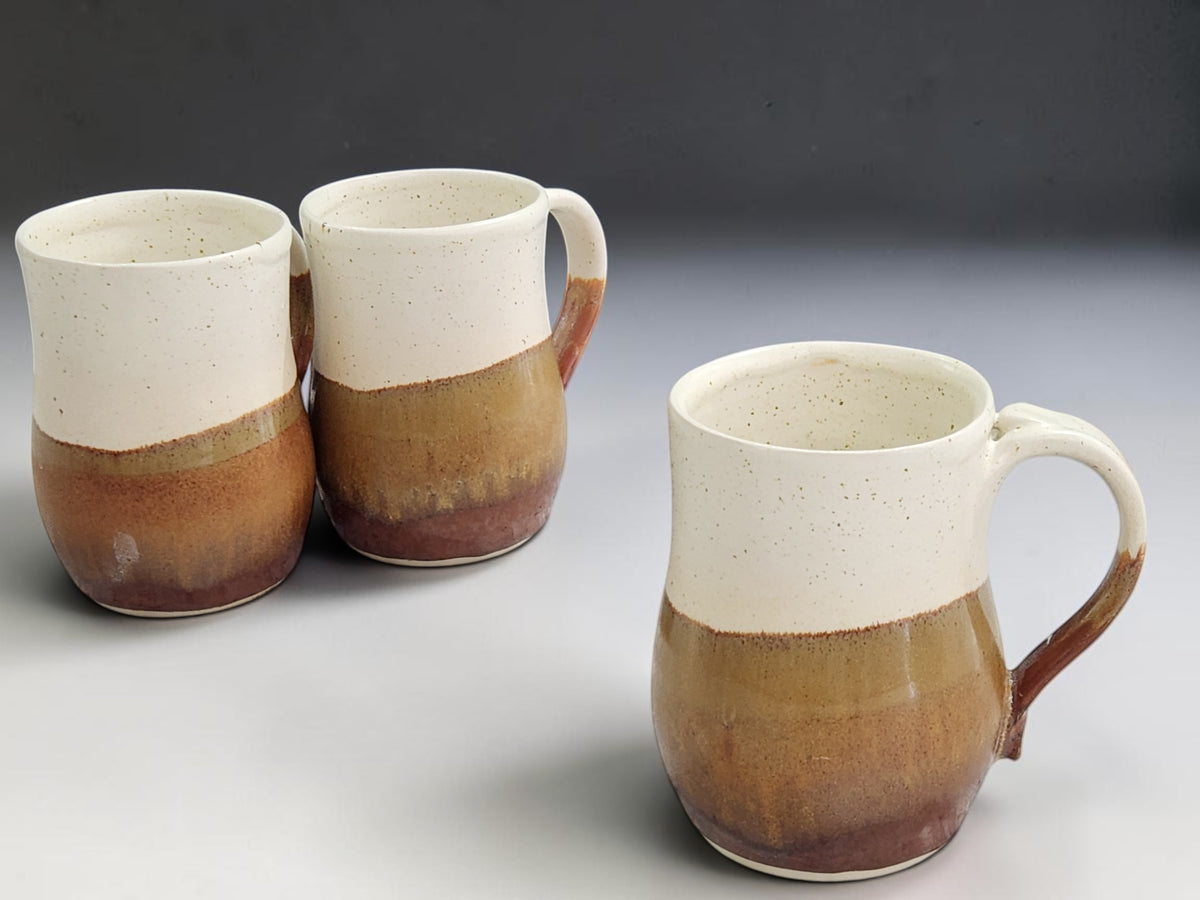 Three handmade 500ml stoneware mugs shown together and available individually
