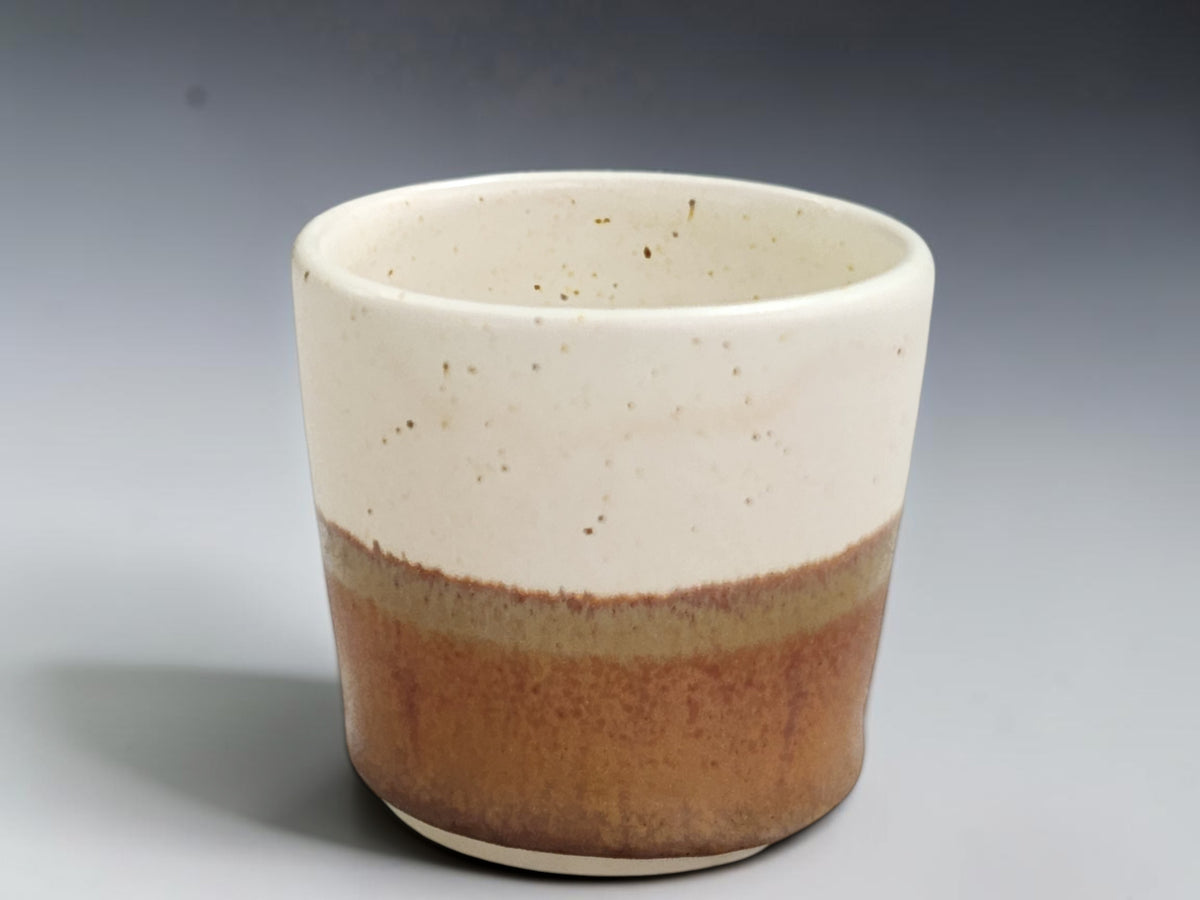 Speckled buttermilk glazed interior of handmade espresso cup