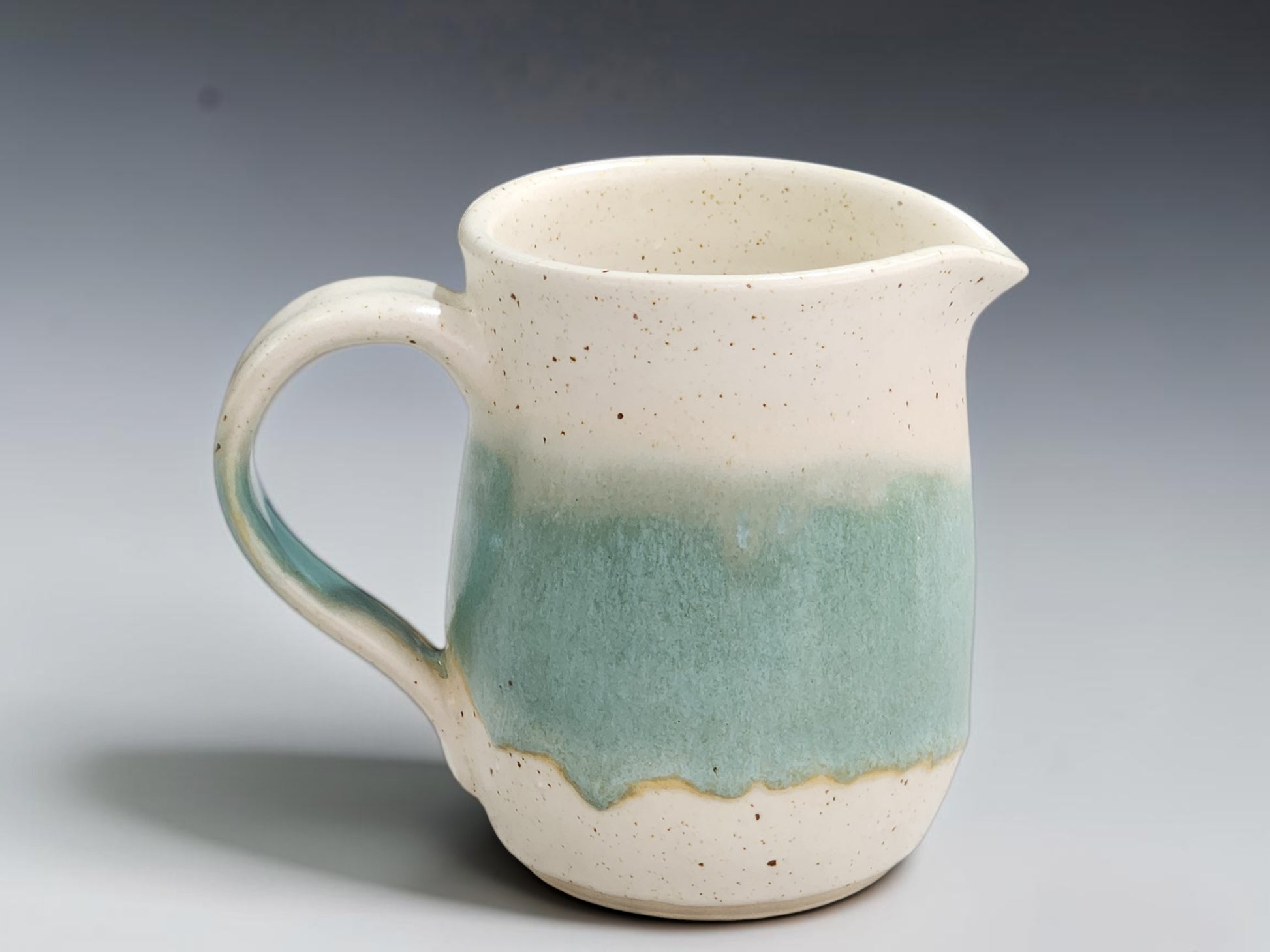Handmade spearmint and speckled cream pottery jug by Buxton Pottery Melbourne