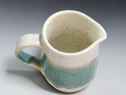 Australian pottery cream jug measuring 10.5cm tall with an 8cm belly