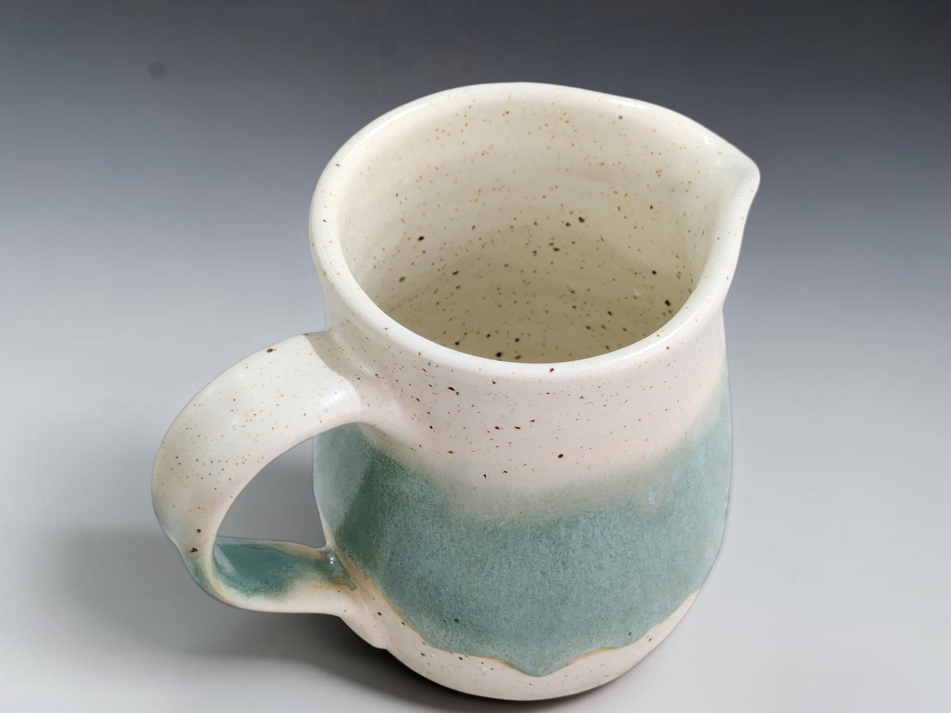 Speckled cream glazed interior of handmade Australian stoneware jug