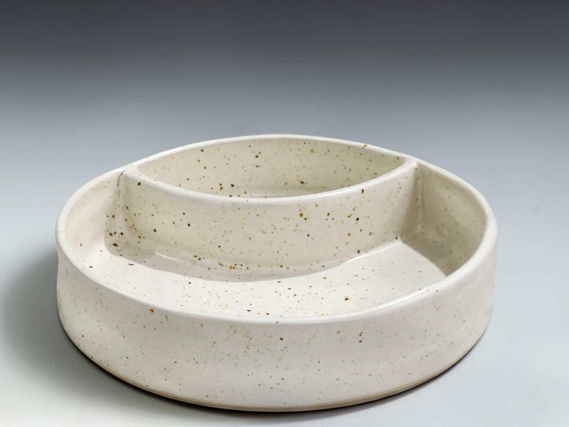 Handmade ceramic snack dish with two sections, food-safe pottery made in Melbourne studio