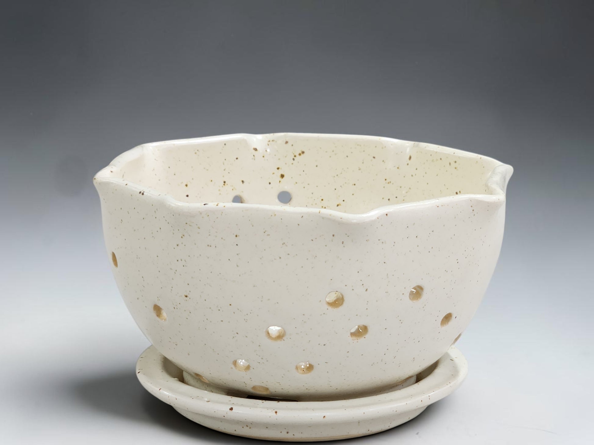 Handmade speckled cream ceramic berry bowl with matching saucer, crafted by Buxton Pottery in Melbourne Australia