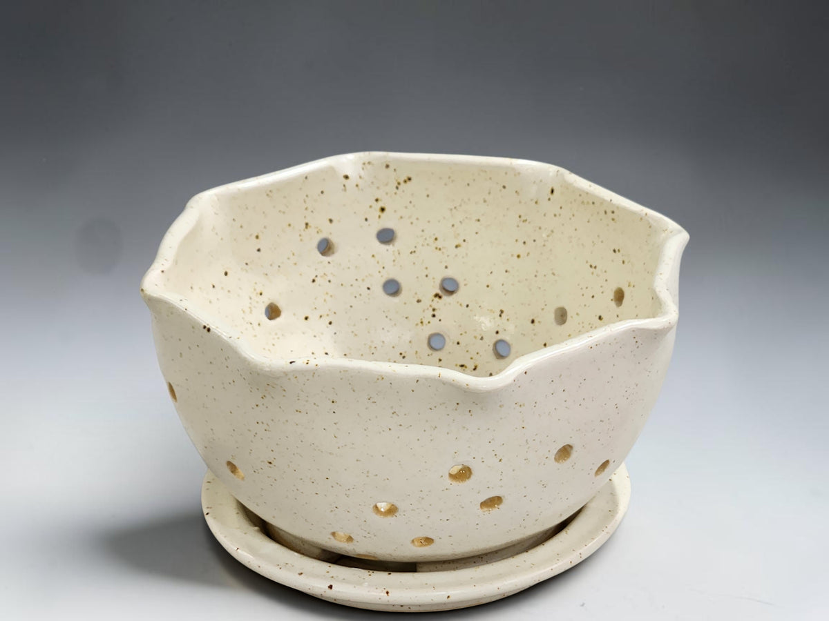 Handmade pottery berry bowl with drainage holes and saucer for washing and serving fresh fruit