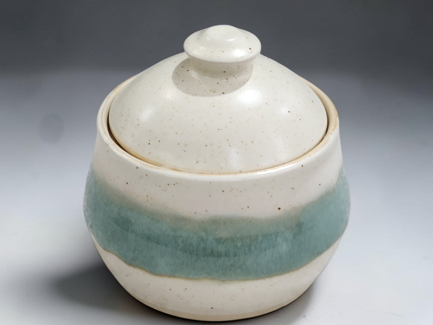 Australian handmade ceramic sugar bowl in soft cream and green glaze, made in Melbourne