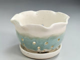 Handmade ceramic berry bowl in speckled cream and soft green glaze