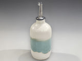 Cream and green glazed oil bottle with pourer by Buxton Pottery