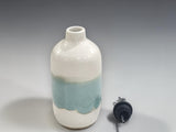 Ceramic oil dispenser in cream and green glaze for kitchen use