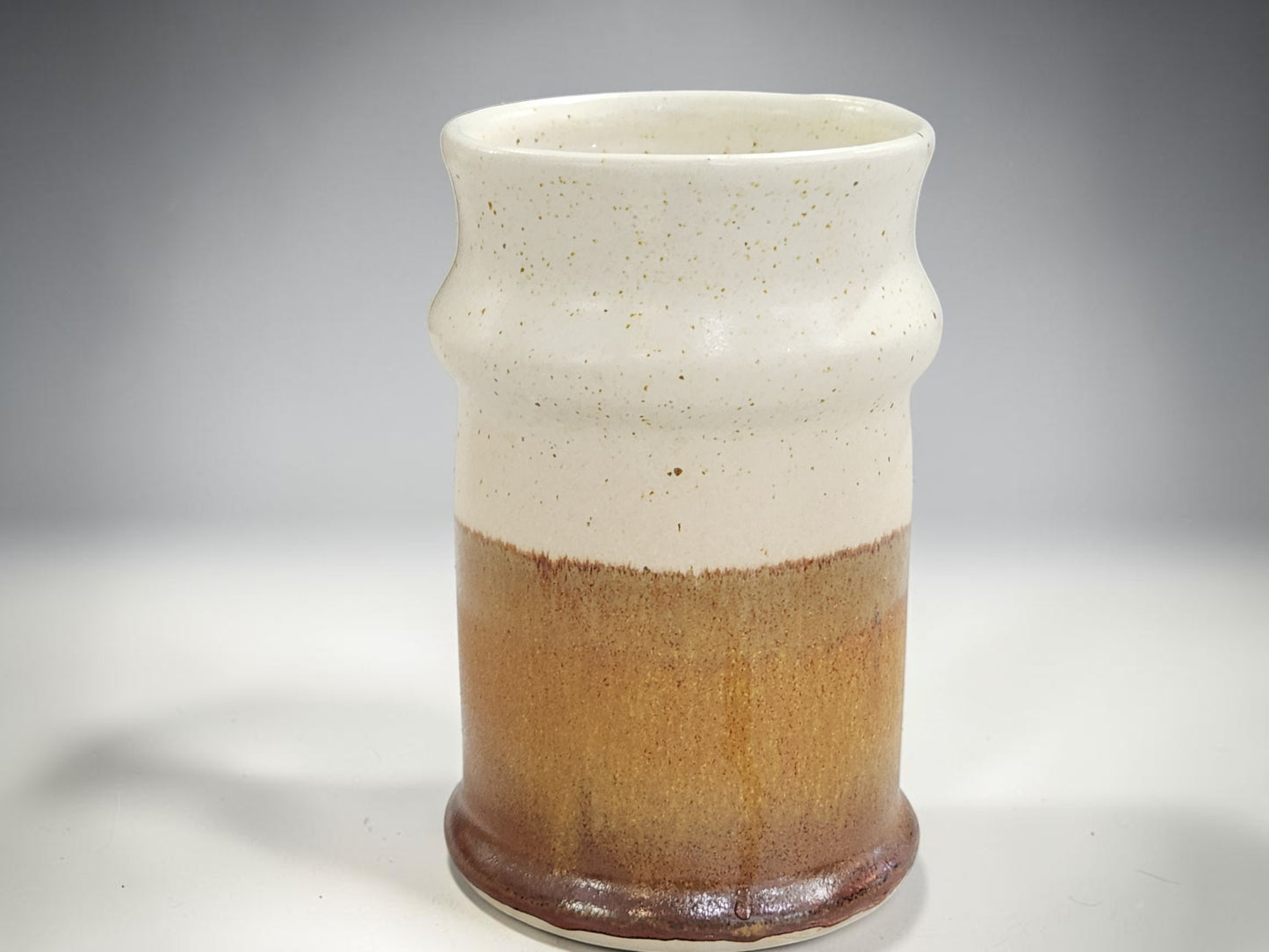 Single handmade ceramic stein with tall shape and curved handle