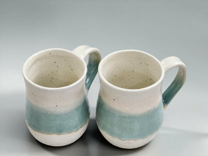 Artisan ceramic mug handmade in Melbourne, featuring a layered green glaze band and natural speckled stoneware finish.