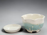small handmade berry bowl green pottery dish with holes and a saucer